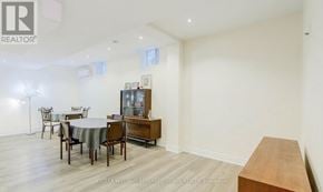 Vaughan (Patterson) apartment for rent - A room with a dining table and chairs.