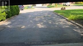 London North (North I) apartment for rent - A street with a sign that says RE/MAX CENTRE CITY REALTY INC., Brokerage.