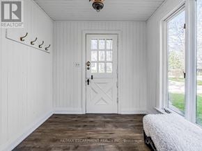 Burlington (Lasalle) apartment for rent - A white door with a window above it in a room with white walls.
