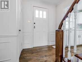 Burlington (Lasalle) apartment for rent - A white door with a window above it in a room.