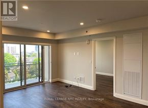 Niagara Falls (Hospital) condo for rent - A room with a sliding glass door leading to a balcony.