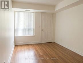 Toronto (Willowdale East) condo for rent - A room with a door and a window with blinds.