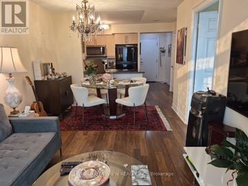 Toronto (Newtonbrook West) condo for rent - A well decorated living room with a dining table and chairs.