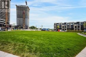 Vaughan (Steeles West Industrial) condo for rent - A construction site with a crane and a building under construction.