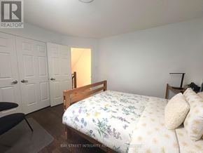 Toronto (Trinity-Bellwoods) townhouse for rent - A bedroom with a bed, chair, and wardrobe.
