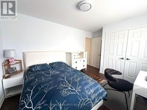 Toronto (Trinity-Bellwoods) townhouse for rent - A bedroom with a bed, chair, and wardrobe.