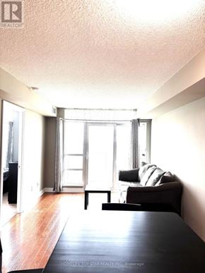 Toronto (Tam O'shanter-Sullivan) condo for rent - A living room with a black table and a couch.