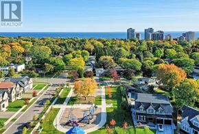 Oakville (Br Bronte) apartment for rent - A park with a playground and a slide is surrounded by houses.
