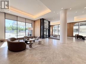 Toronto (Bayview Village) condo for rent - A spacious room with a kitchenette and a bar area.