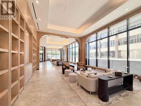 Toronto (Bayview Village) condo for rent - A room with a view of a construction site through the windows.