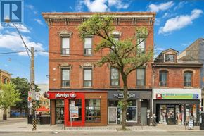 Toronto (Kensington-Chinatown) condo for rent - A street view of a building with a red awning that says Wendy's.