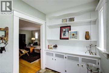 Waterloo apartment for rent - A living room with a white cabinet and a painting on the wall.