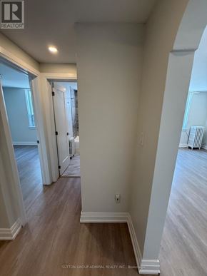 Toronto (Forest Hill South) house for rent - A hallway with wood floors and white walls.