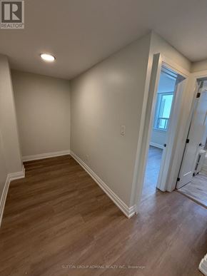 Toronto (Forest Hill South) house for rent - A room with wood flooring and white walls.