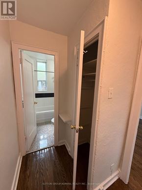 Toronto (Yonge-Eglinton) multi-family for rent - A hallway with a doorway leading to a bathroom.