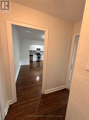 Toronto (Yonge-Eglinton) multi-family for rent - A hallway with a white door and a white wall.