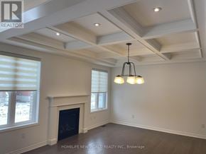 Innisfil apartment for rent - A well-lit room with a fireplace and a chandelier.