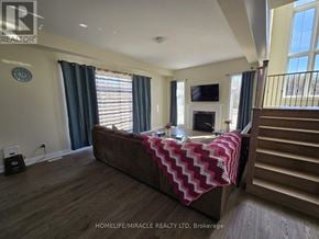 Oro-Medonte apartment for rent - A bedroom with a large bed and a television on the wall.