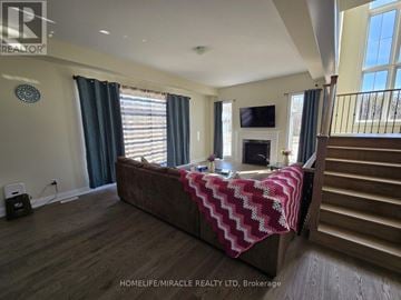Oro-Medonte apartment for rent - A bedroom with a large bed and a television on the wall.