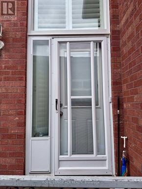 Vaughan (West Woodbridge) apartment for rent - A white door with a glass panel and a handle.