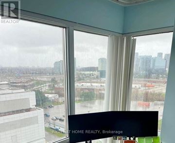 Toronto (Woburn) condo for rent - A window with a view of a cityscape and a sign that says "RICHAT HOME REALTY, Brokerage".
