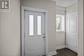 Mississauga (Applewood) townhouse for rent - A white door with a glass panel is in a room with white walls.