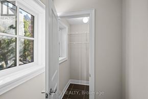 Mississauga (Applewood) townhouse for rent - A hallway with a door on the right and a window on the left.