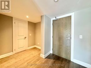 Whitchurch-Stouffville (Stouffville) condo for rent - A room with a white door and a wooden door.
