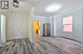 Hamilton apartment for rent - A room with a white door and a window with blinds.