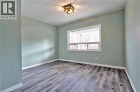 Hamilton apartment for rent - A room with a window and a wooden floor.