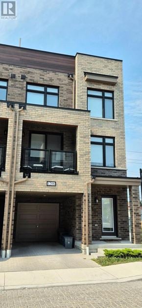 Pickering (Village East) townhouse for rent - A modern two-story house with a garage.