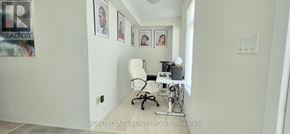 Pickering (Village East) townhouse for rent - A white room with a desk and a chair.