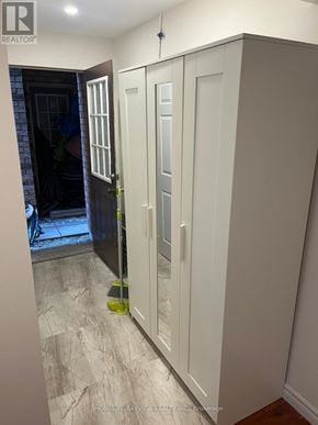 Vaughan (Patterson) apartment for rent - A white cabinet with glass doors is in a room.