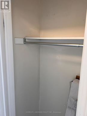 Markham (Cornell) apartment for rent - A white closet with a metal rod hanging from the top.