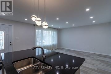 Mississauga (Lakeview) apartment for rent - A modern kitchen with a stainless steel sink and pendant lights.