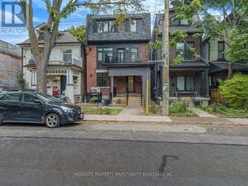 Toronto (Palmerston-Little Italy) apartment for rent - A black car is parked on the side of a street.