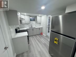 Caledon apartment for rent - A kitchen with a refrigerator on the right and a counter on the left.