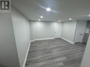 Caledon apartment for rent - A room with wooden flooring and white walls.