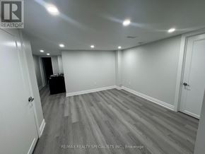 Caledon apartment for rent - A room with grey flooring and white walls.