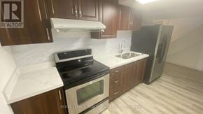 Markham (Milliken Mills East) apartment for rent - A kitchen with a stove, oven, sink, and refrigerator.