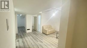 Markham (Milliken Mills East) apartment for rent - A room with a couch and a chair in it.