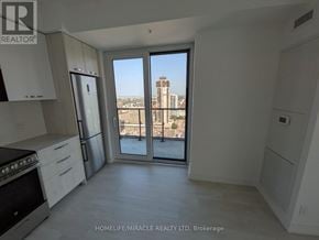Hamilton (Corktown) condo for rent - A kitchen with a view of the city.