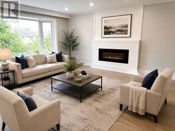Toronto (Bendale) apartment for rent - A living room with a fireplace and a painting on the wall.