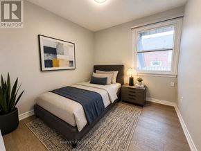 Toronto (Bendale) apartment for rent - A bedroom with a bed, nightstand, and a painting on the wall.