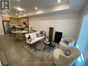 Brampton (Fletcher's Creek South) townhouse for rent - A living room with a couch, chairs, and a coffee table.