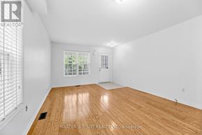 Markham (Wismer) apartment for rent - A living room with a couch, chair, and a rug.