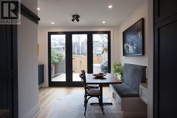 Toronto (University) townhouse for rent - A dining area with a table and chairs is shown in the image.