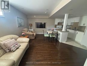 Newmarket (Woodland Hill) apartment for rent - A living room with a couch, chairs, and a dining table.