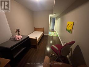Newmarket (Woodland Hill) apartment for rent - A bedroom with a bed, desk, and chair.