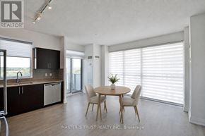 Oakville (Co Central) condo for rent - A dining room with a table and chairs is shown in the image.